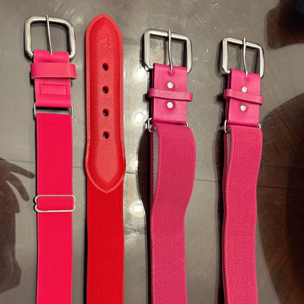 Red and Pink softball belts. Sized small/medium
